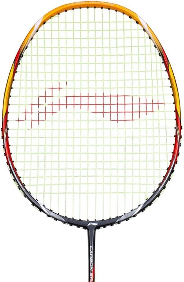 Introducing the Li-Ning Carbon Series A700 Badminton Racket - Gold/Black, featuring a sleek black frame adorned with vibrant yellow and red accents. The green strings add to its visual appeal, while the Dynamic-Optimum Frame guarantees exceptional performance. The shaft is marked with "CARBONEX" for authenticity.