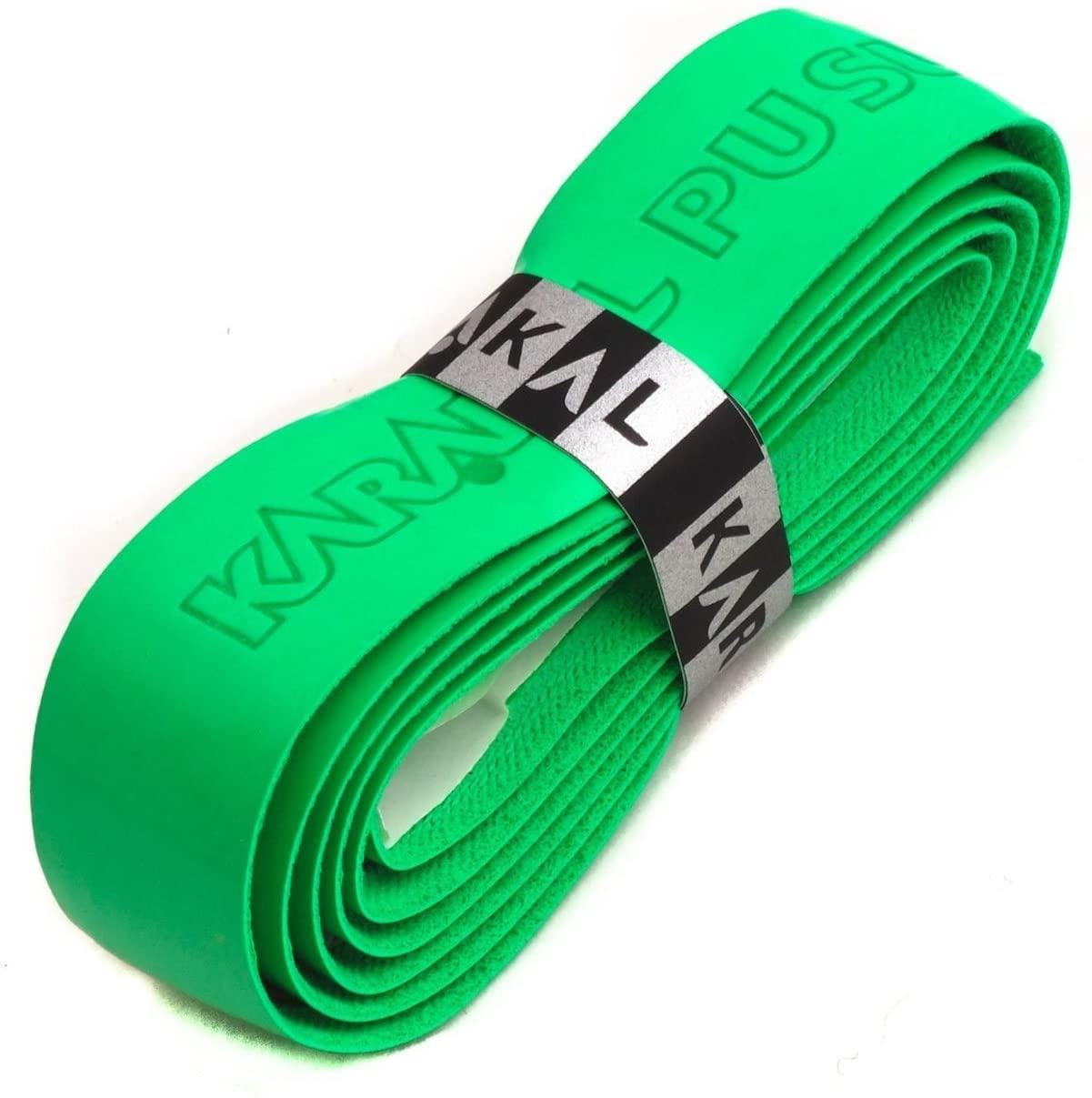 A rolled-up vibrant green tennis overgrip, ideal for racket sports, is secured with a black and silver band featuring the "Karakal" brand and highlighting its PU Badminton Super Grip technology.