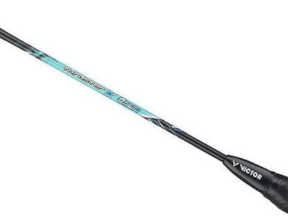 Close-up of a Victor Thruster Onigiri Badminton Racket (Frame Only), highlighting its sleek shaft design in blue and black. The "Thruster K Onigiri" text emphasizes the advanced power features, enhanced by Core Shell Rubber technology for optimal performance.