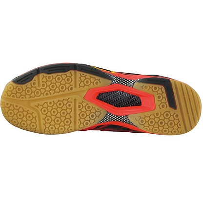 The image highlights the sole of the Victor SH A920 Red Badminton Shoes, featuring a gum-colored base with circular tread patterns and subtle black accents, making them ideal for indoor sports. The red and black design on the arch area offers excellent lateral support, perfect for badminton players seeking agility on the court.