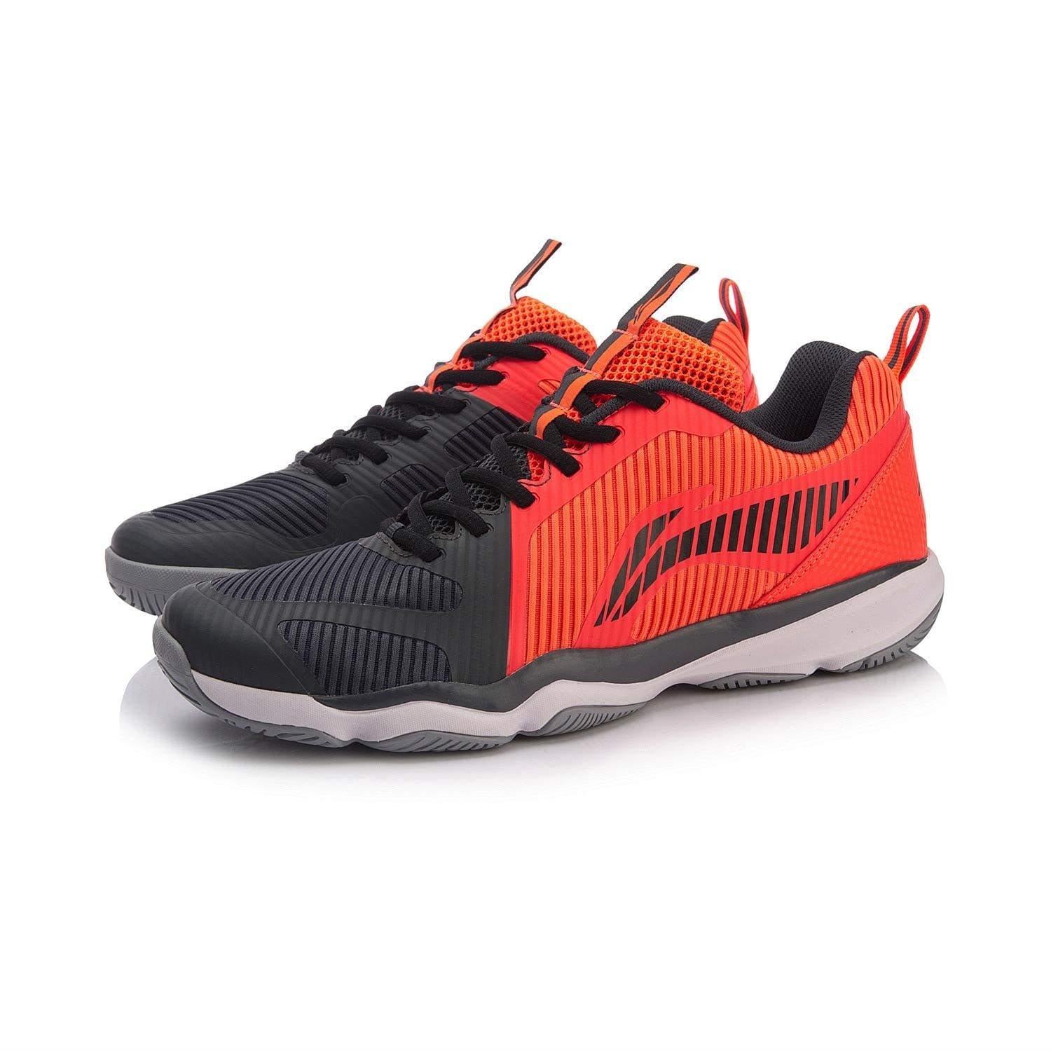 Introducing the Li-Ning Ranger TD Men's Badminton Shoes, a fashionable sports shoe from Li-Ning that features vibrant red and black breathable mesh uppers. These shoes showcase a sleek design with striped patterns, complemented by black laces and a white biometric outsole for improved performance during your game.