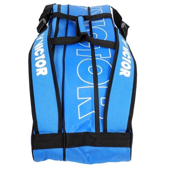 A Victor Doublethermo Badminton Bag 9111 in blue, featuring black straps and white text, perfect for carrying your rackets.