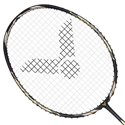 Close-up of the Victor Jetspeed S10C Badminton Racket - Black Gold, showcasing its sleek black and gold design on the frame, crafted with premium Japanese carbon fiber. It features a checkered string pattern that forms an eye-catching stylized logo in the center, all set against a plain white background.