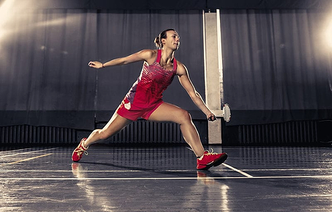 Young Female Player on Badminton Court