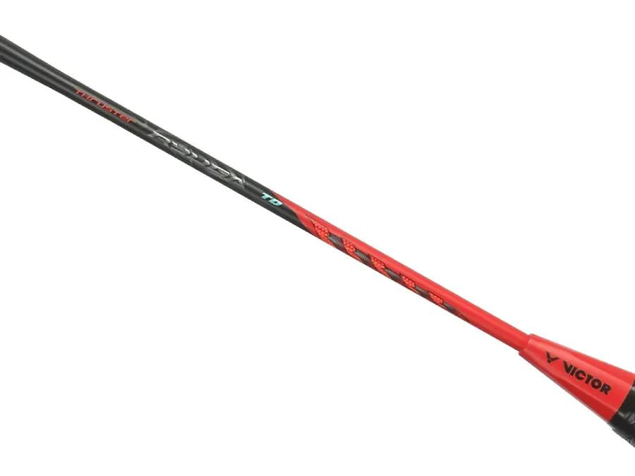 A close-up of the Victor Thruster Ryuga TD C 4U Badminton Racket in black/red, showcasing "VICTOR" branding on the shaft, detailed handle design, and advanced Power Box technology.