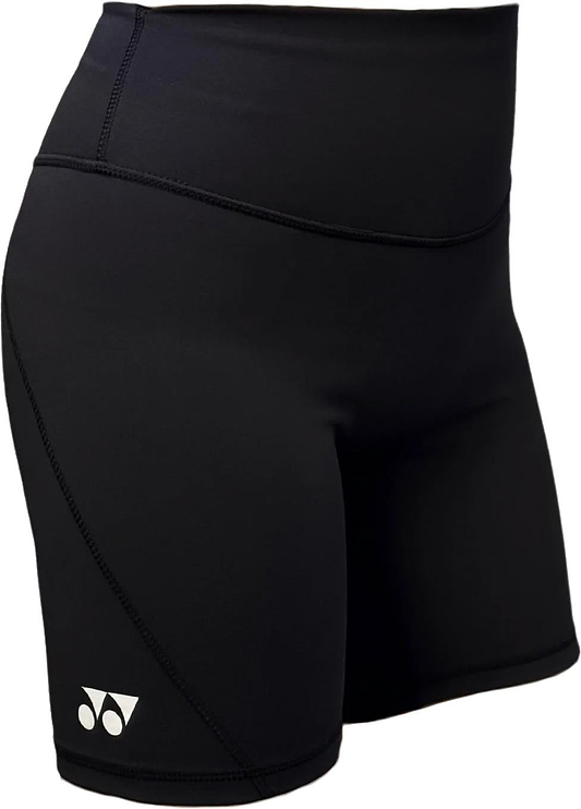 The Yonex YTS2024 Womens Core Badminton Shorts in black feature a small white logo, high-waisted moisture-wicking fabric, and smooth, stretchy material—ideal for sports or workouts. Shown worn in the image. Brand: Yonex.