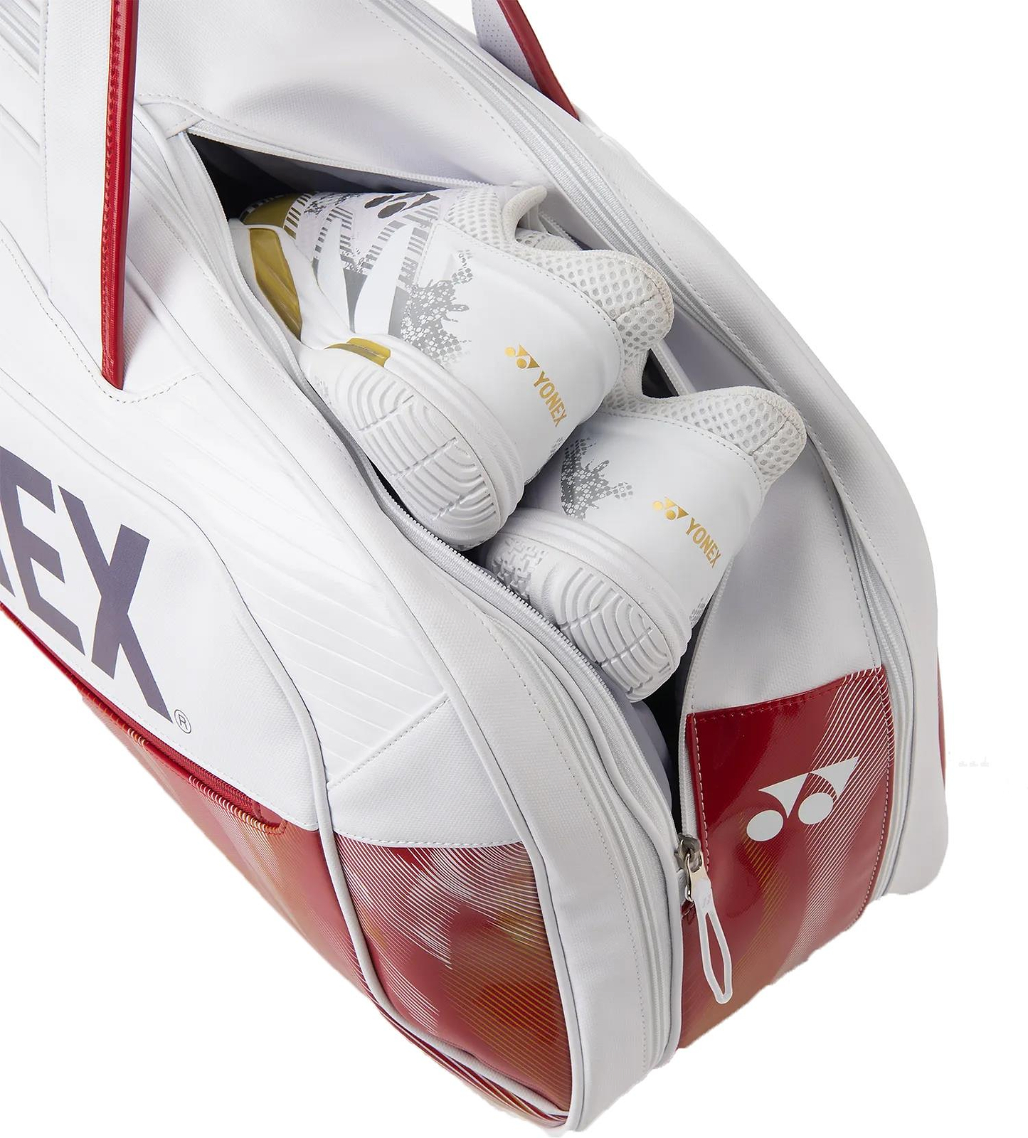 A Yonex 02631WEX Expert Tournament Badminton Bag in white, partially unzipped, reveals a pair of white Yonex athletic shoes with gold accents neatly packed inside—a perfect tournament companion.