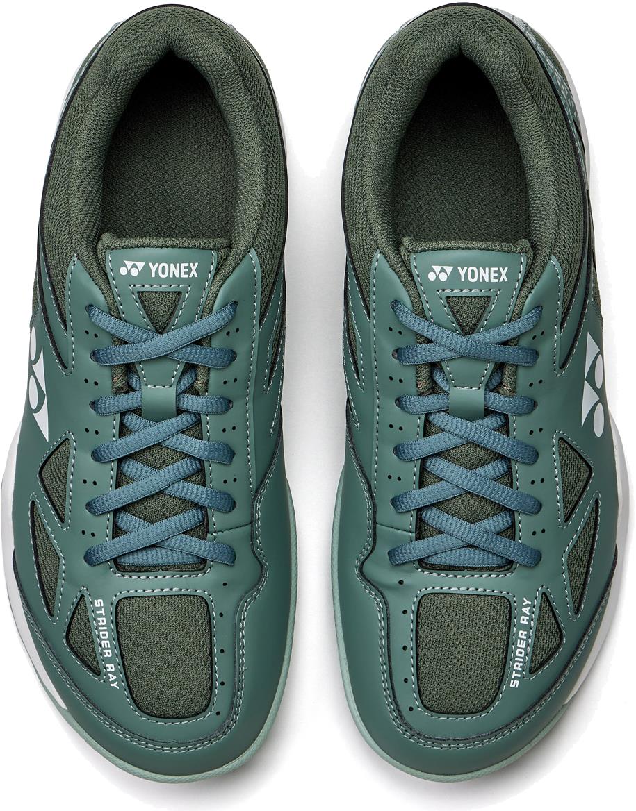 A pair of khaki Yonex Strider Ray WIDE unisex badminton shoes, seen from above, featuring the Yonex logo on the tongue and side, mesh panels for breathability, Power Cushion comfort, and "STRIDER RAY" text on the front.