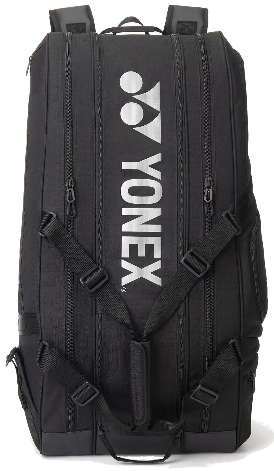 The Yonex BA72629EX Gearlogic 9 Racket Badminton Bag in black features multiple zippered compartments, adjustable shoulder straps, and the bold white Yonex logo on the front—ideal for carrying up to 9 rackets.