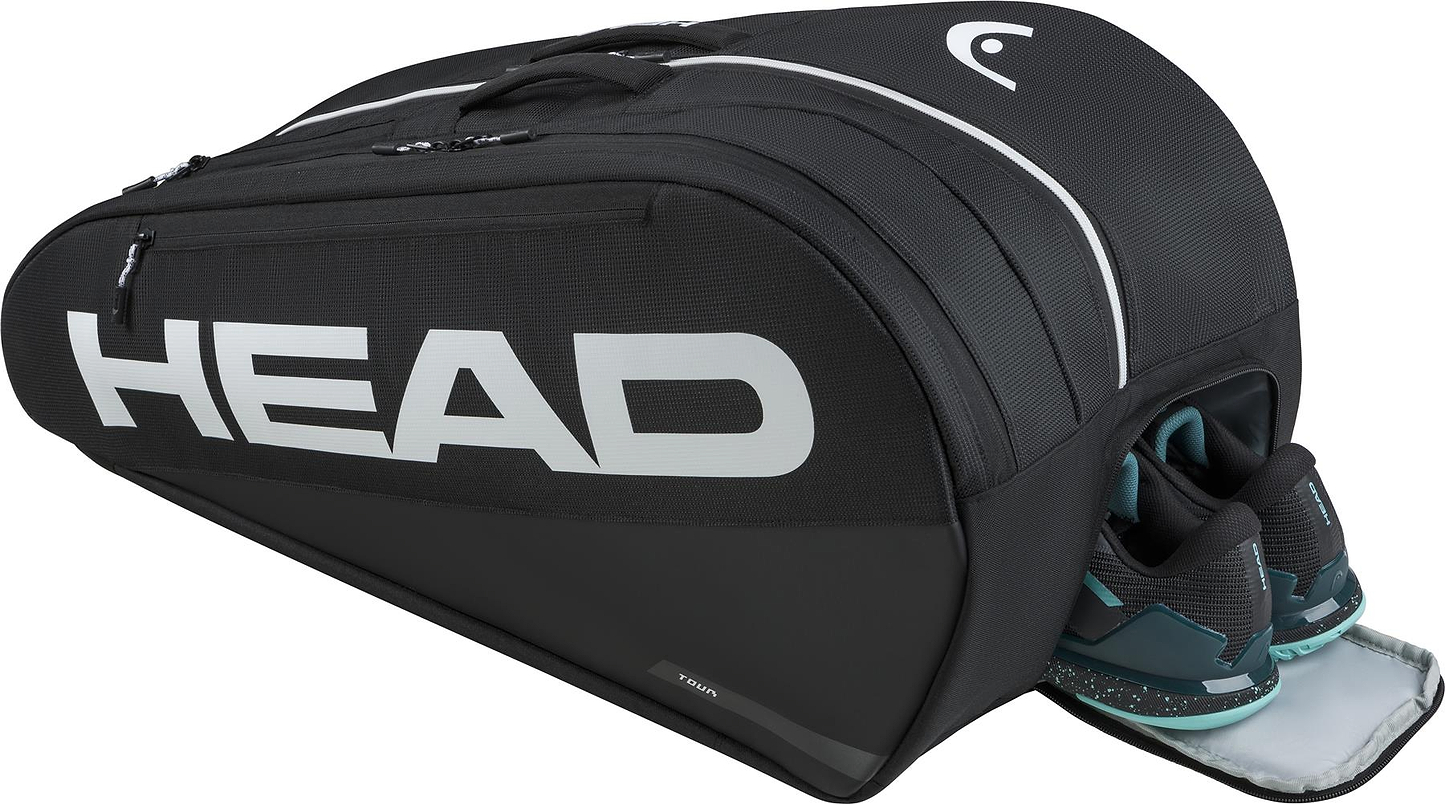 The HEAD Tour 9 Racket Badminton Bag L - Black by HEAD features multiple compartments with CCT+ climate control, white accents and logo, and is shown holding a pair of black and teal athletic shoes.