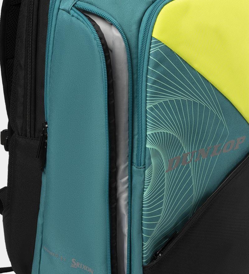 A close-up of the Dunlop SX Performance Badminton Backpack shows its teal, black, and yellow panels. A compartment reveals room for rackets in its gray interior, and the Dunlop brand is displayed on a geometric-patterned fabric.