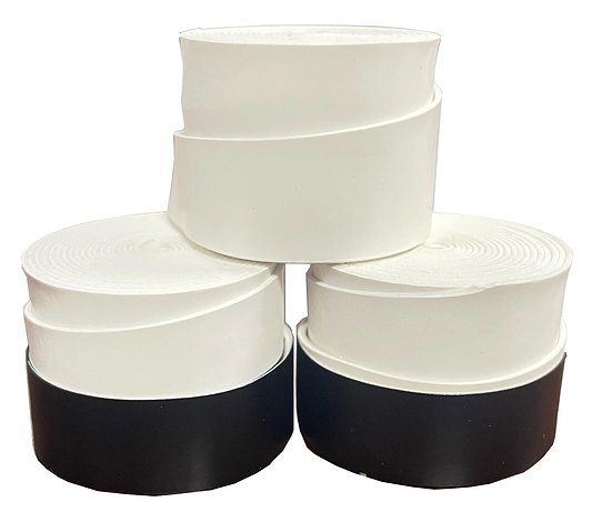 Three BadmintonHQ Badminton Overgrip - White (3 Pack) cylindrical containers are stacked in a pyramid, with two at the base featuring black bases and one all-white on top, highlighting their comfort and shock absorption qualities.