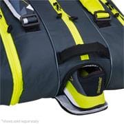 Close-up of a Babolat RHX12 Pure Aero Racket Bag in grey and yellow, with an open compartment showcasing tennis shoes and a tennis ball inside—ideal for tournament players.