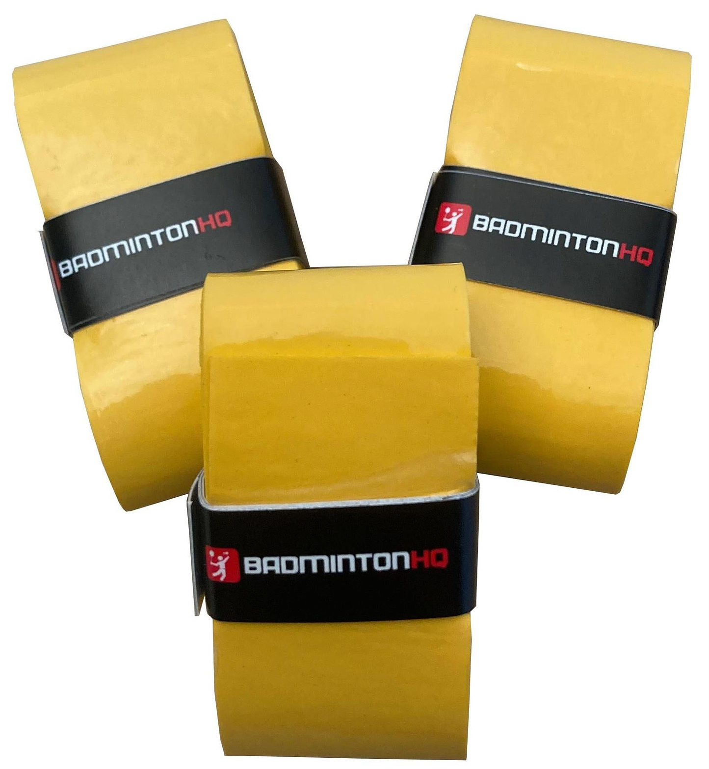 Three BadmintonHQ Sunset Yellow Overgrips from the 3 Pack stand upright, each wrapped with a black band featuring “BADMINTONHQ” in white and red text. Their tacky finish and grouped, angled display highlight the brand’s style.