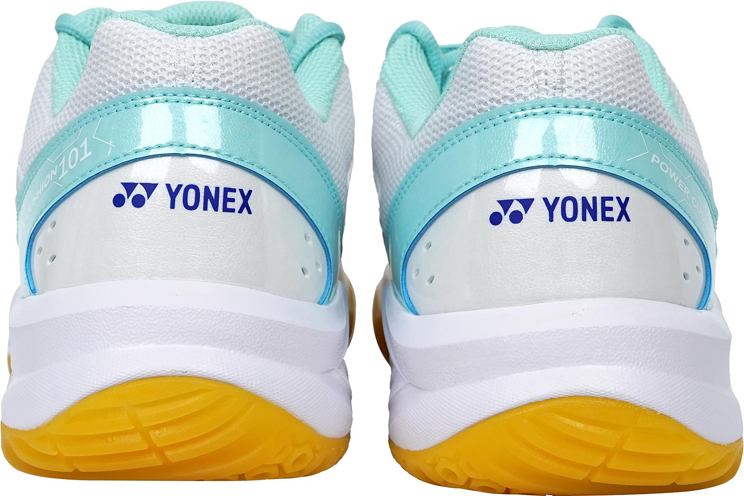 Back view of Yonex Power Cushion SHB 101 Badminton Shoes in white/mint with mesh uppers, light blue accents, and yellow rubber soles. Features Yonex logo and Power Cushion for superior shock absorption on the heel.