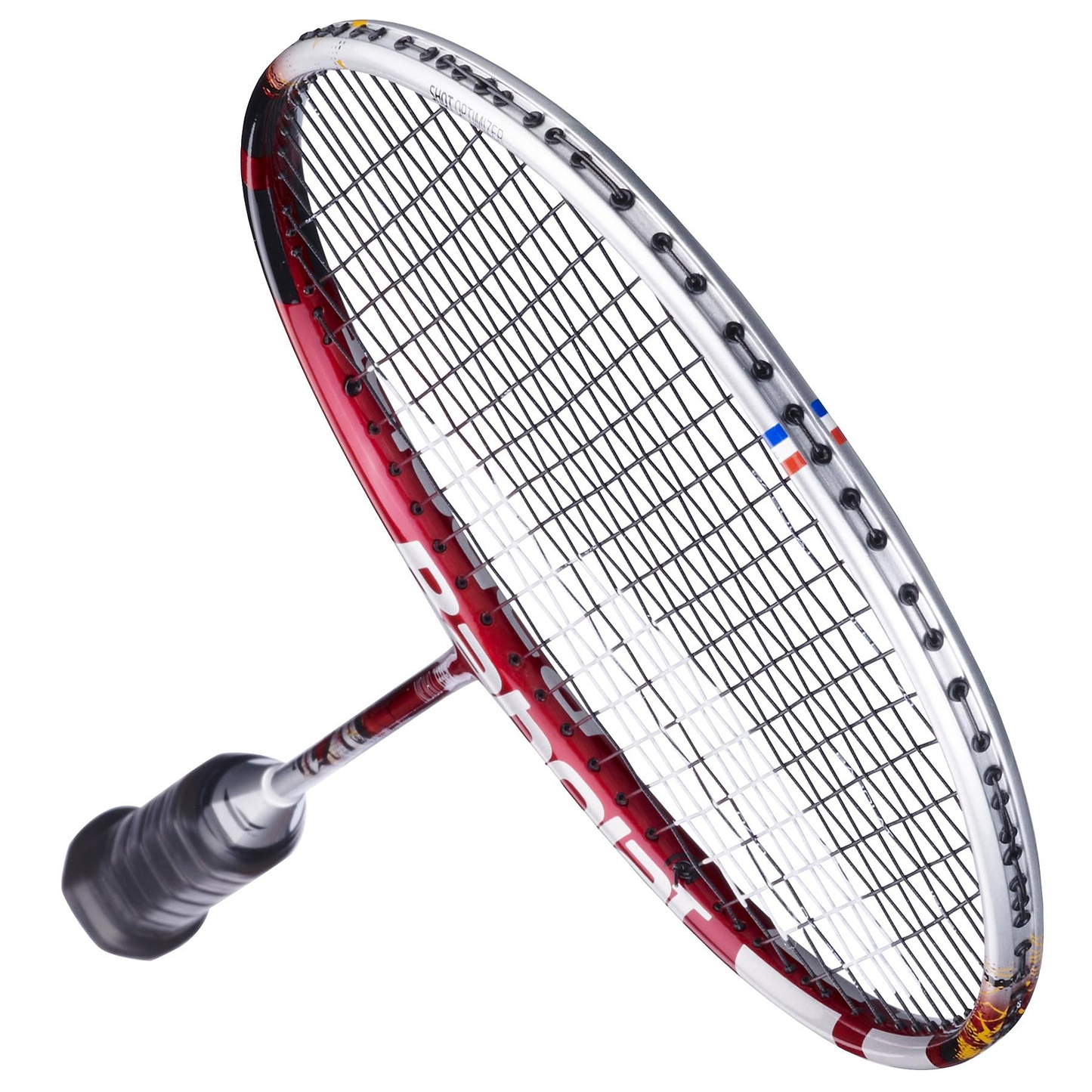 A close-up of the Babolat X-Feel Origin 2026 3U Badminton Racket in white and red shows its tightly strung strings, angled frame, and black grip handle, capturing the power potential of this top-quality Babolat racket.