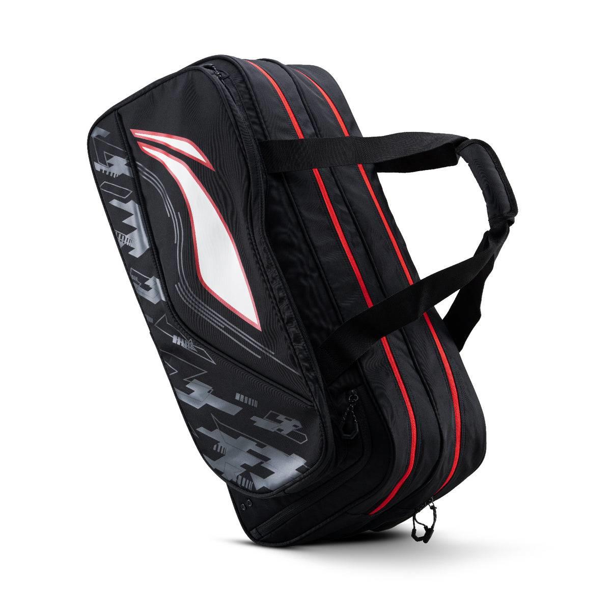 The Li-Ning Team 6 Racket Badminton Bag in black features zipper compartments and carrying handles, making it ideal for storing up to 6 rackets or as a kit bag. It stands upright on a white background.