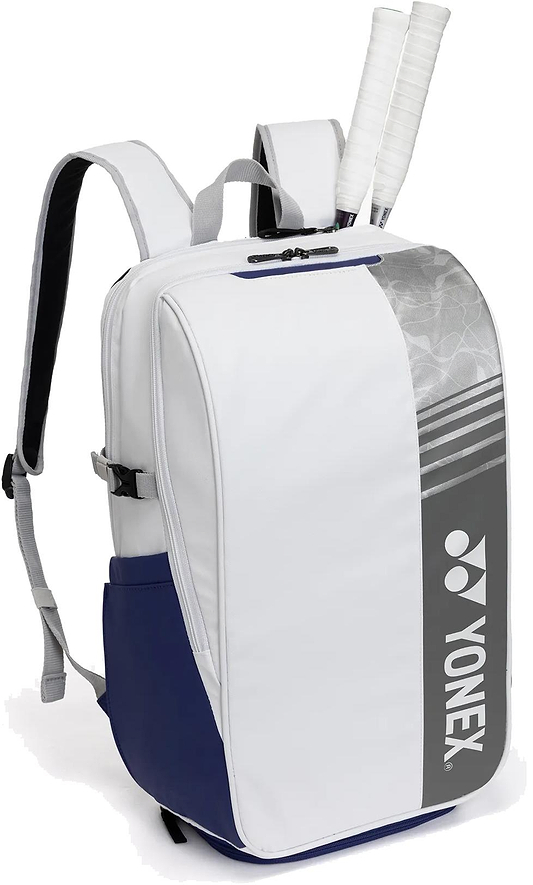 The Yonex BA52512EX Club Badminton Backpack in white and blue features a gray Yonex logo on the front, padded shoulder straps, and a top racquet compartment holding two tennis racquets.