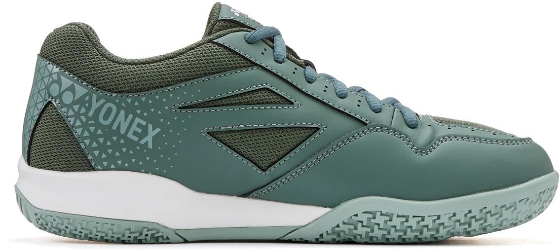 A khaki Yonex Strider Ray WIDE unisex badminton shoe with a textured sole and mesh accents is shown in side profile on a white background.