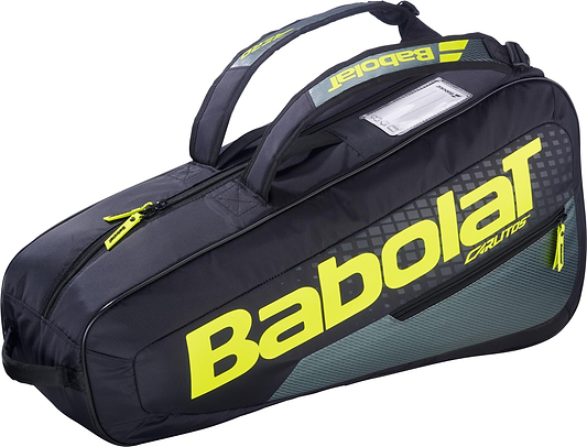 The Babolat RH Carlitos Junior 3 Racket Badminton Bag in black/yellow has a bold yellow Babolat logo, carrying handles, zipper, and rectangular ID window—ideal for juniors to carry rackets and gear.
