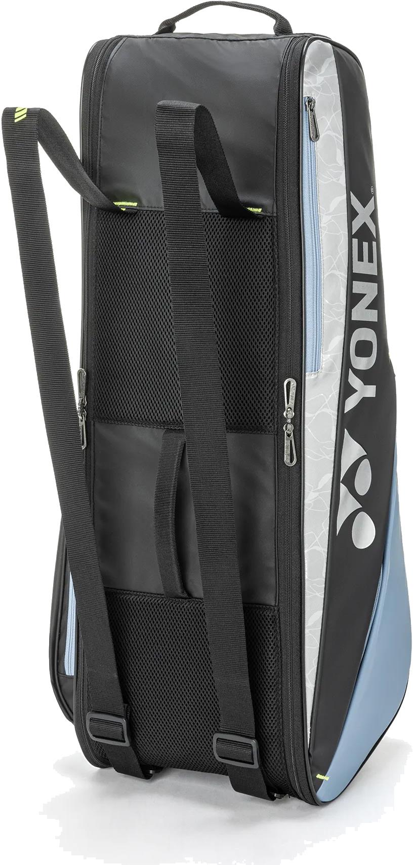 The Yonex BA52526EX Club 6 Racket Badminton Bag in black and blue has shoulder straps for backpack-style carrying, mesh ventilation, multiple zippered compartments, and features the Yonex logo and name on the side.