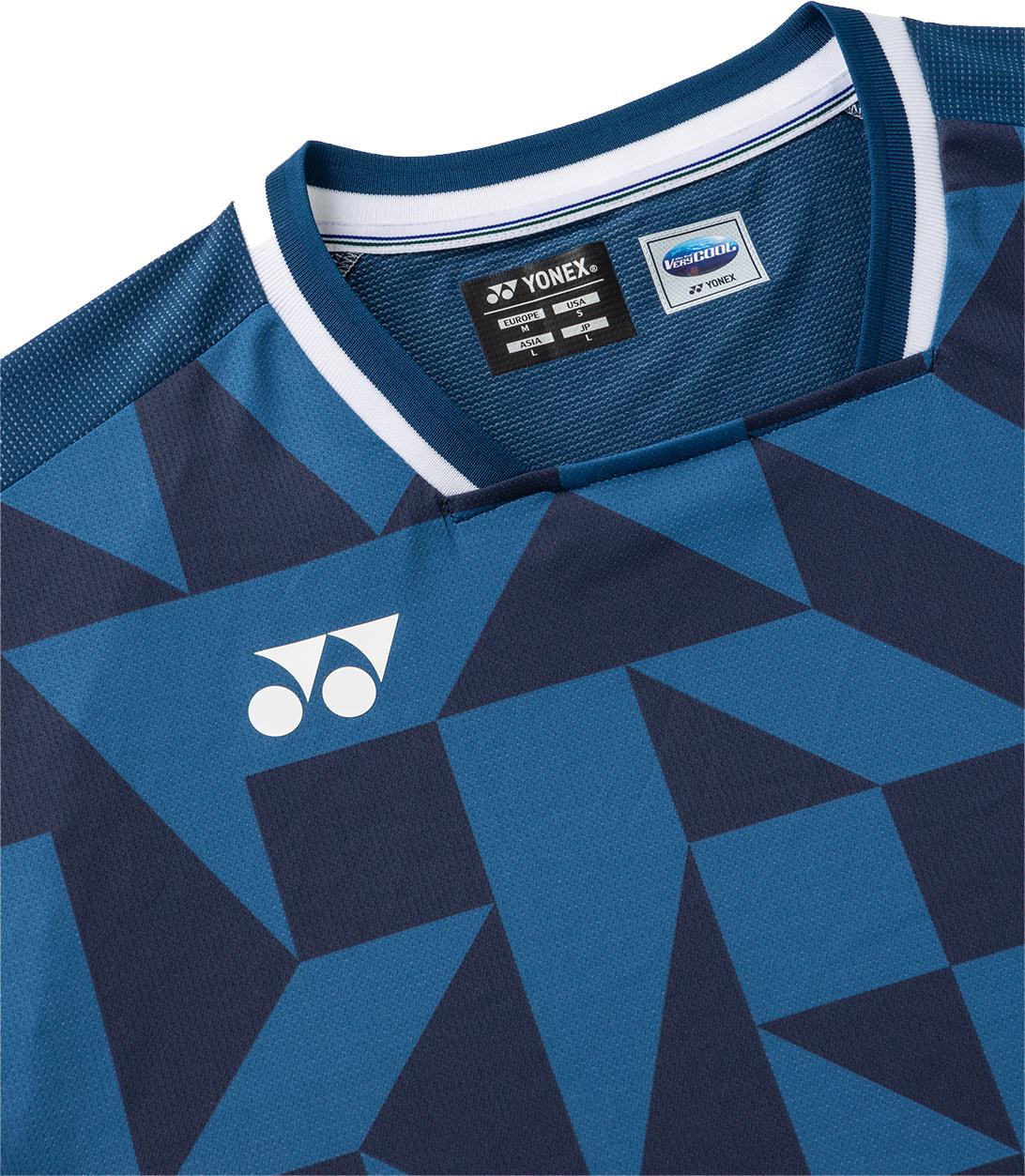 Close-up of the Yonex 10712YX Crew Neck Men’s Badminton T-Shirt in Indigo Blue, featuring geometric navy and blue patterns and a white Yonex logo on the chest. This quick-drying sports shirt has tag details inside the collar.