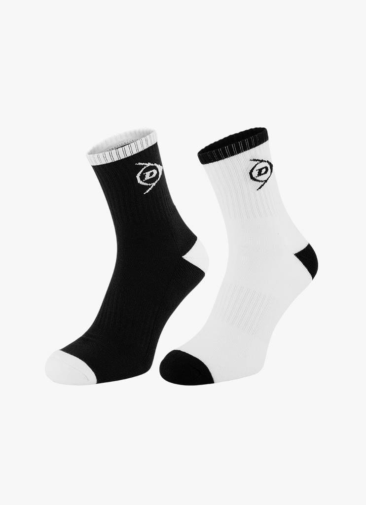 This pair from the Dunlop Performance Men's Sports Socks (2 Pack) in sizes UK6-11 includes one black and one white sock, each highlighted with contrasting toe, heel, and top bands. Both socks are adorned with the Dunlop logo on the side and are set against a plain background.