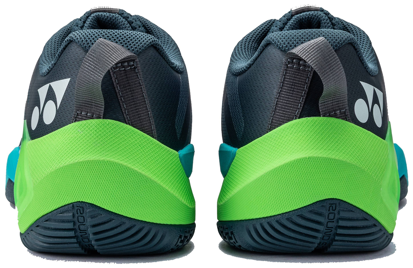 Rear view of the Yonex Subaxia GT WIDE 2026 Unisex Badminton Shoes in Dark Green, displaying black, gray, green, and blue accents. The white Yonex logo appears on the heel with a textured outsole for grip and Power Cushion Rev technology.