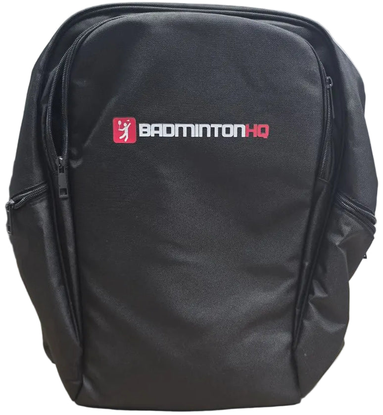 The BadmintonHQ Badminton Backpack - Black features white and red BADMINTONHQ branding, two zipped side compartments, and a spacious central section—ideal as your everyday racket backpack.