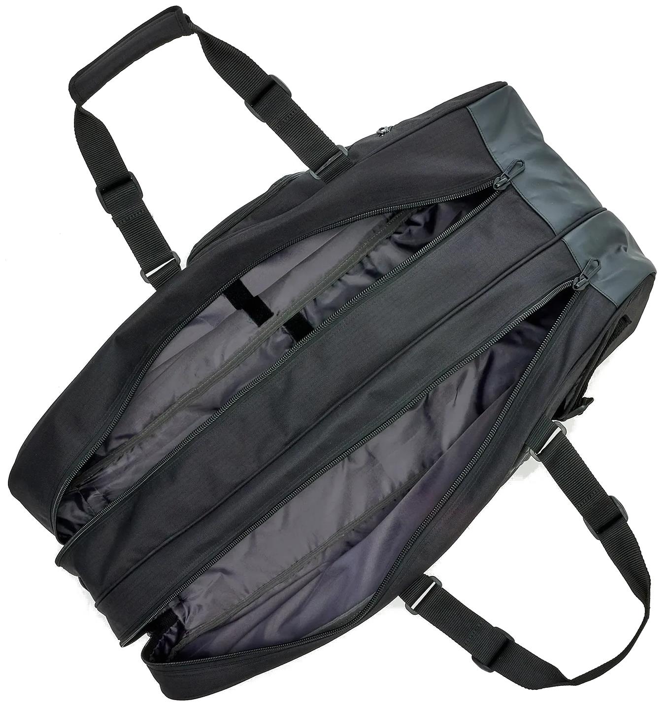The Yonex BA72626EX Gearlogic 6 Racket Badminton Bag in black features two shoulder straps, dual zippers, and a spacious gray-lined interior for convenient storage.