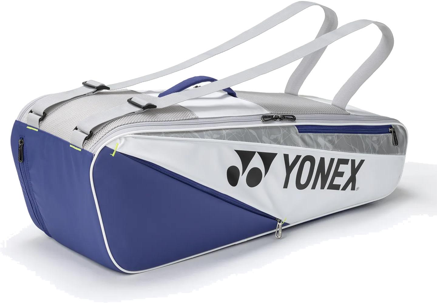 The Yonex BA52526EX Club 6 Racket Badminton Bag in white and blue features dual shoulder straps, zippered compartments for equipment, and the Yonex logo on the side.