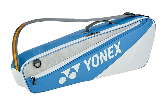 The Yonex 52523EX Club 3 Racket Bag in Greyish Blue is ideal for tennis or badminton, featuring a shoulder strap and carrying handle. It has a spacious zippered compartment to neatly store rackets and essentials.