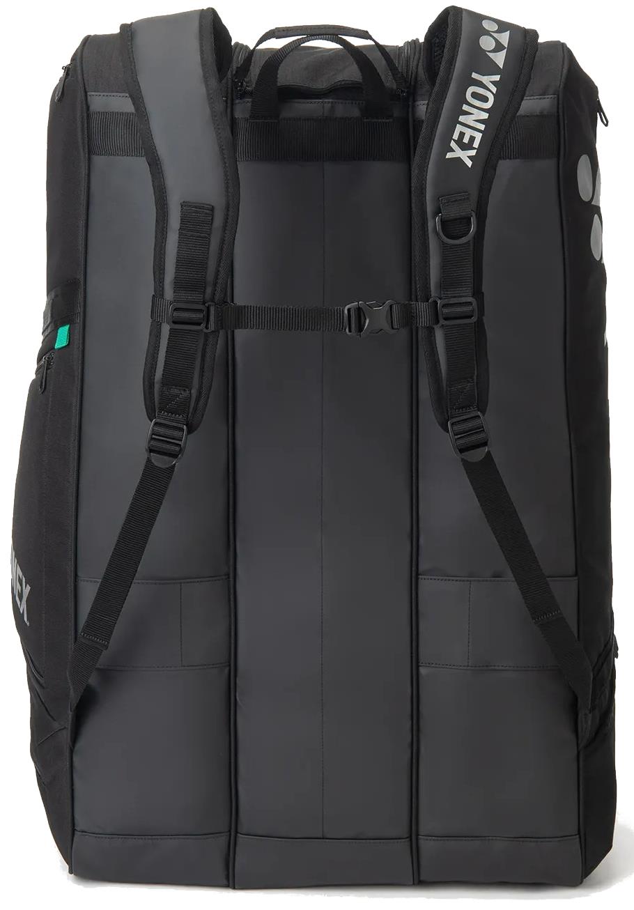 The Yonex BA726212EX Gearlogic 12 Racket Badminton Bag in black features padded shoulder straps, a sternum strap, carry handles, and multiple compartments—ideal for serious players needing a tournament-ready Yonex bag.