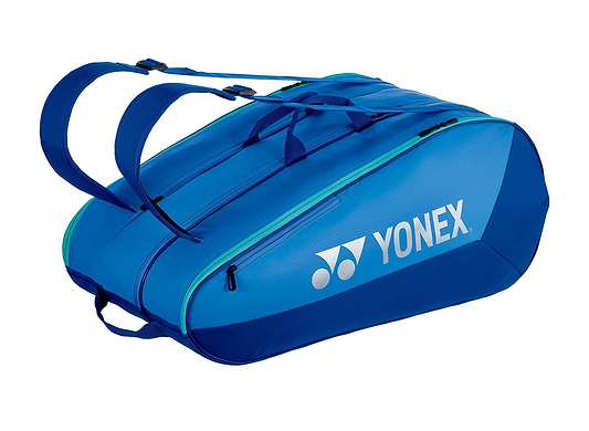 The Yonex 425212EX Team 12 Racket Badminton Bag in Blast Blue features two main zippered compartments, adjustable shoulder straps, and a prominent brand logo on the side—perfect for stylishly carrying your rackets.