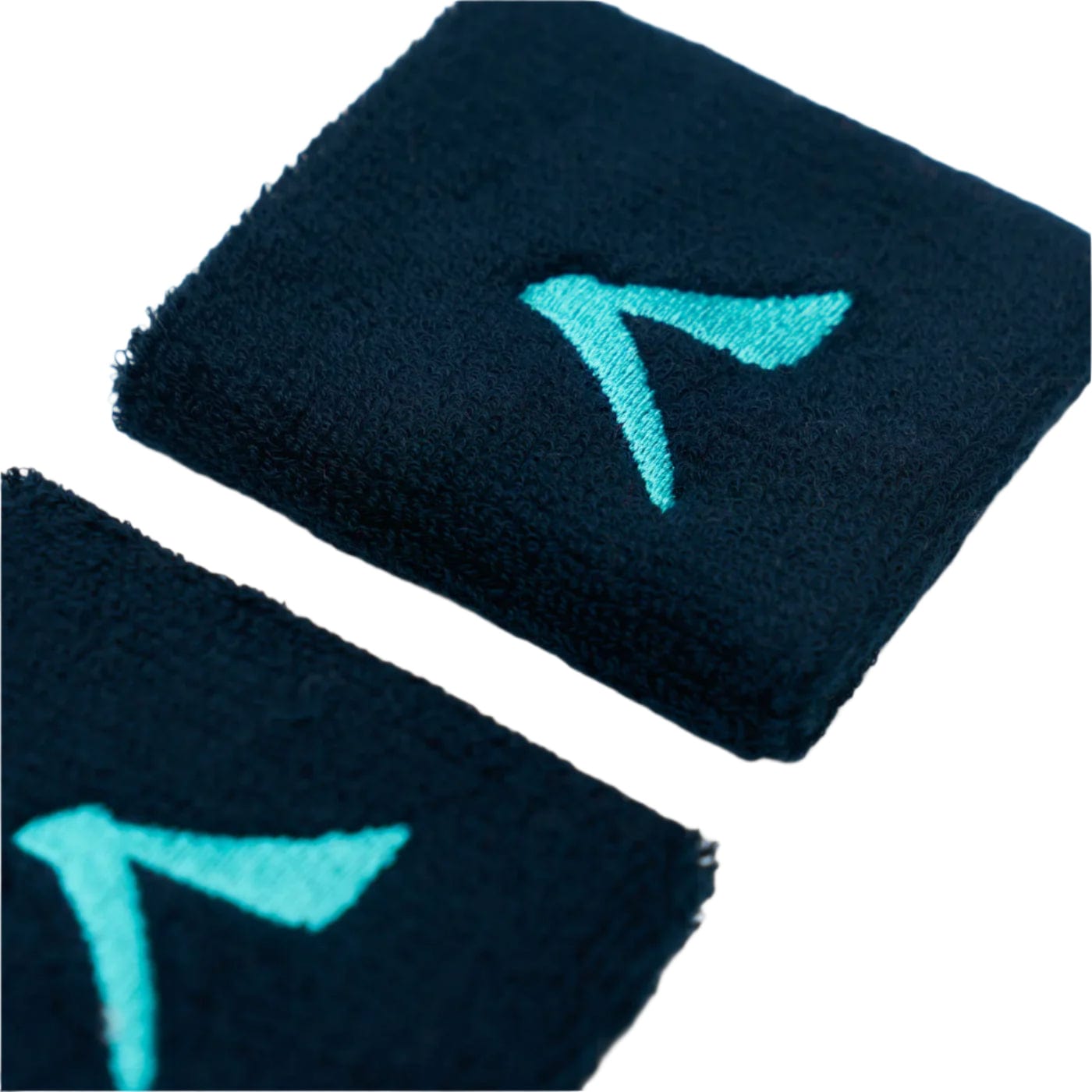 Close-up of two navy Kanso 7cm Wristbands with a turquoise logo resembling a stylized "A" or arrow, crafted from absorbent fabric for comfort, set elegantly on a white background.
