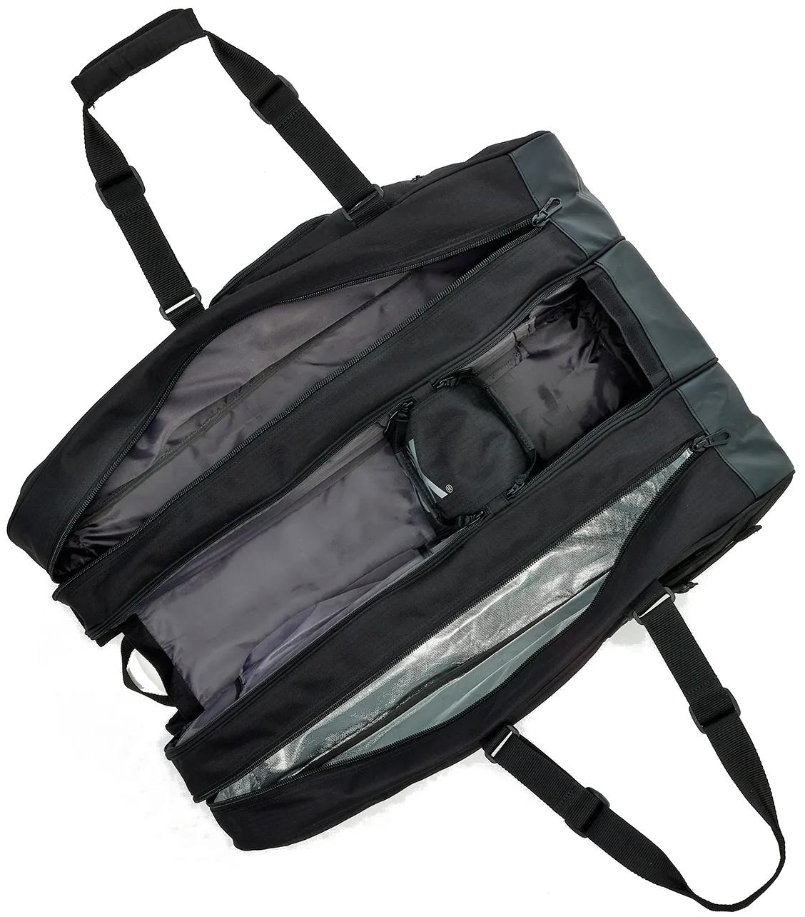 The Yonex BA726212EX Gearlogic 12 Racket Badminton Bag in black has two large zippered side compartments and a smaller central pocket—shown open from above on a white background, making it ideal for badminton tournaments.