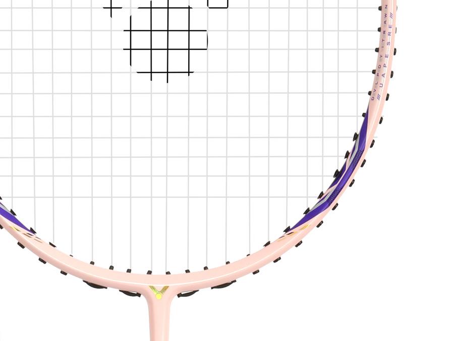 Close-up of the Victor Auraspeed 7100 4U Badminton Racket in light pink by Victor, featuring black strings and purple and yellow accents on the frame, with part of the logo visible against a white background.
