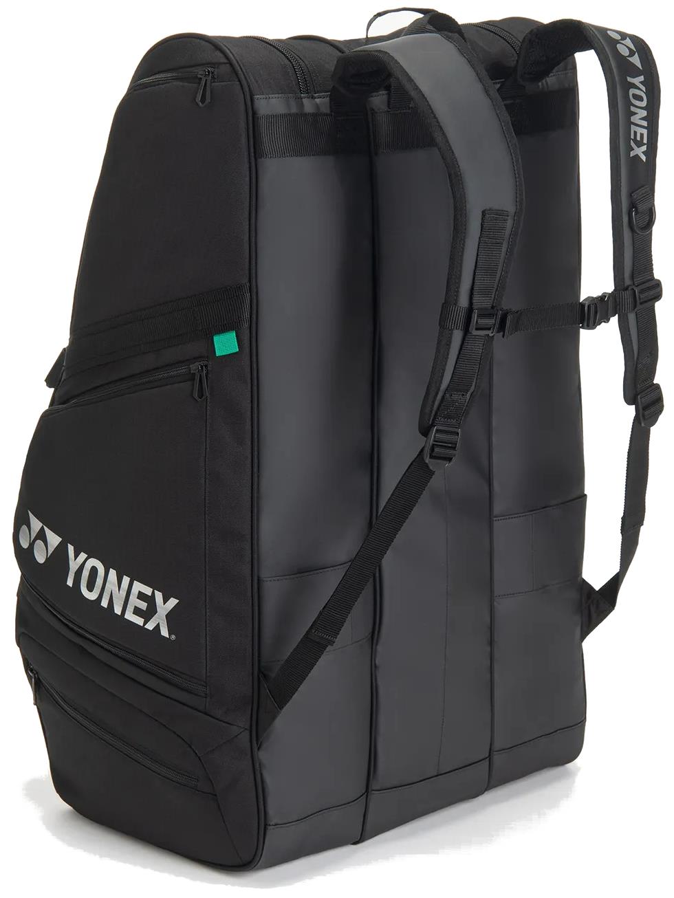 The Yonex BA726212EX Gearlogic 12 Racket Badminton Bag in black features multiple compartments, zippers, and padded adjustable shoulder straps—ideal for carrying sports gear to your next badminton tournament.