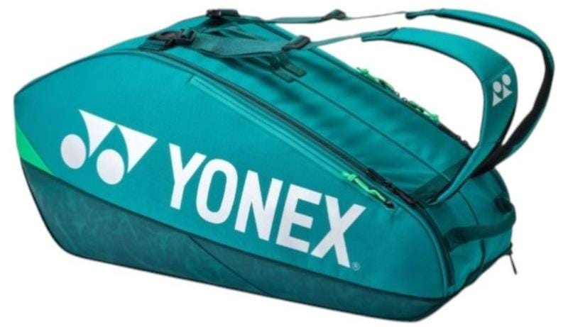 The Yonex 92426EX 6 Racket Pro Badminton Bag in dark green features a large white Yonex logo, zippered compartments, and padded shoulder straps—perfect for carrying up to 6 rackets and your badminton gear.