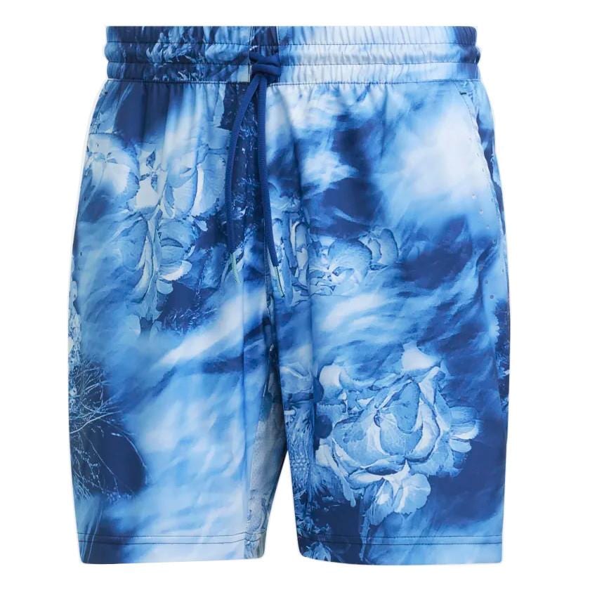 The adidas Melbourne Mens Ergo Graphic Shorts in Victory Blue feature a drawstring waist with a tie-dye pattern and floral designs. Made from recycled materials, these shorts offer a soft and comfortable fabric, ideal for casual wear.