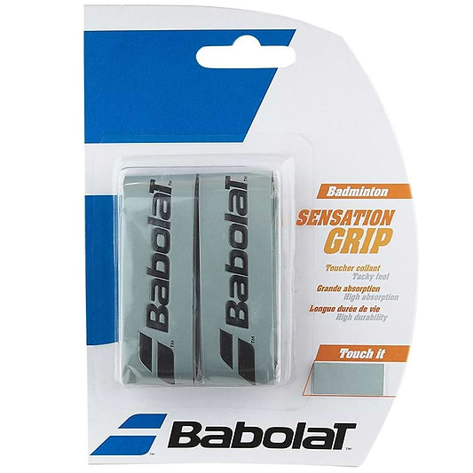 The packaging for Babolat Badminton Grip Sensation - Silver - 2 Pack is ideal for badminton players looking for premium match play. It comprises two grips that showcase branding and offer a tacky feel to boost control and longevity. The packaging predominantly displays blue and white hues, complemented by vivid orange accents.