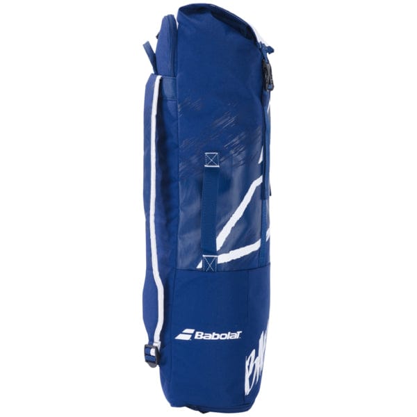 The Babolat Backrack 2 Bag Blue/White is a stylish tennis bag designed in blue and white, made from recycled PET. The iconic Babolat logo is prominently displayed, and it includes a zip closure, handle, and adjustable shoulder strap. A white graphic design adds to its contemporary look, making it an excellent option for those seeking racket bags.
