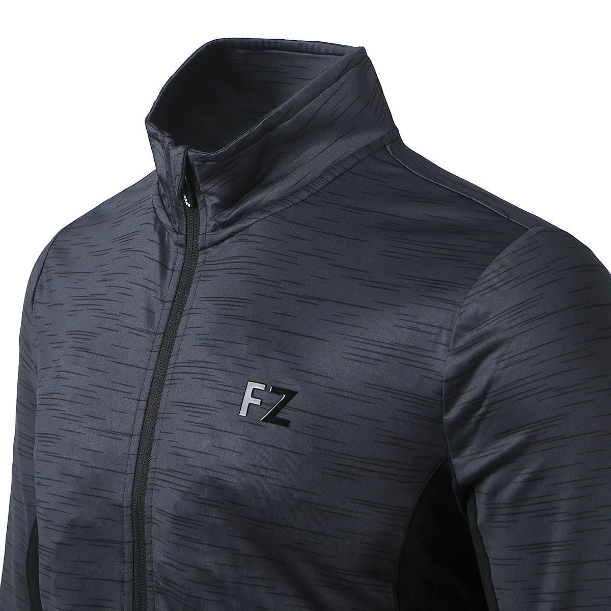 The FZ Forza Savoy Women's Badminton Jacket in black features a high collar with a subtle stripe pattern. Designed with a front zipper and the "FZ" logo on the chest, this stretchable jacket combines comfort and style perfectly.