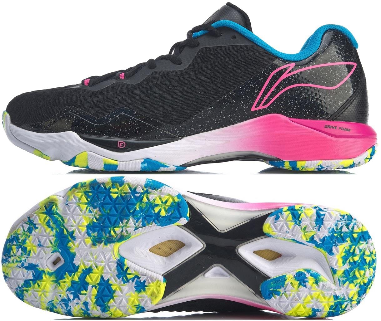 The Li-Ning Dagger II SE Men's Badminton Shoes, in a black upper with pink and blue accents, feature a vibrant sole adorned with blue, yellow, and green patterns. This sleek design is enhanced by Drive Foam technology to provide superior grip and stability on the court.