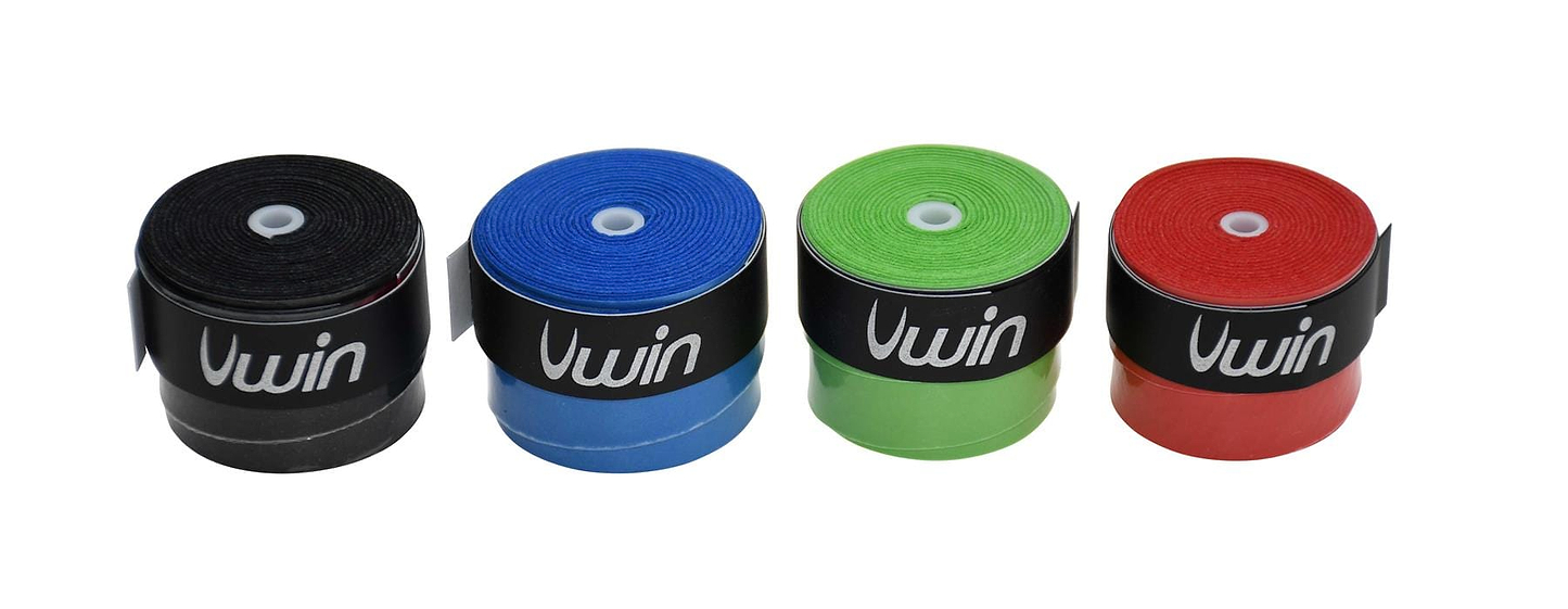 Four rolls of athletic tape in an array of vibrant colors: black, blue, green, and red. Each roll resembles the Uwin Badminton Overgrip, featuring "Uwin" on a distinctive black band. The rolls are neatly lined up in a row, offering a colorful selection ideal for enhancing any racket handle.
