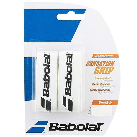 The packaging of the Babolat Badminton Grip Sensation - White - 2 Pack displays two white grips featuring the Babolat logo. It emphasizes attributes such as "tacky grip," "great absorption," and "long life." The design primarily uses white and blue with orange text, providing a comfortable racket grip.