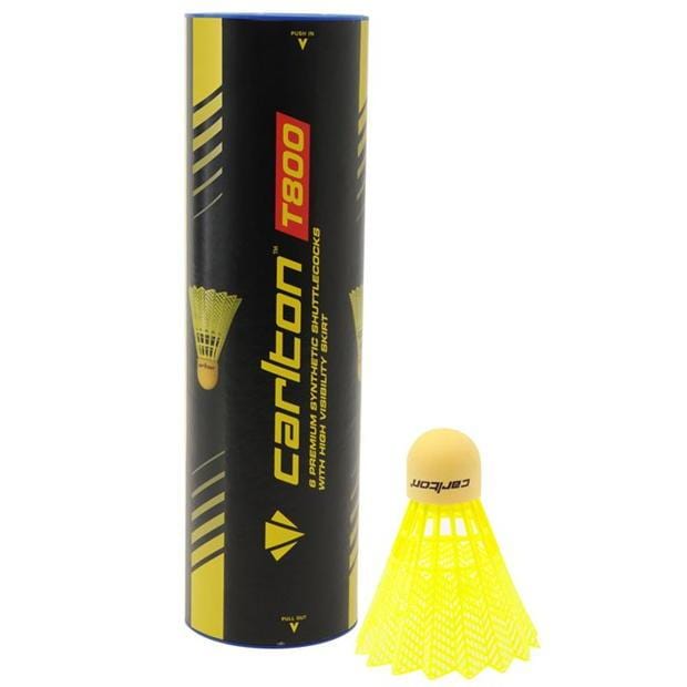 A synthetic shuttlecock in yellow and orange is upright beside a black cylindrical tube labeled "Carlton T800 Yellow Fast Badminton Nylon Shuttles - Tube 6," perfect for club use. The tube features striking yellow and red text alongside an eye-catching graphic of a shuttlecock.