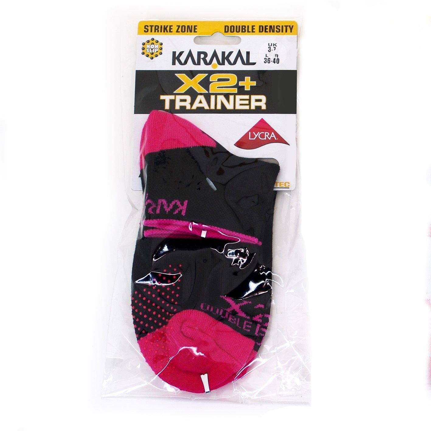 Product Package: Karakal X2+ Women's Technical Trainer Badminton Sock in black and pink, suitable for UK sizes 3-7. These socks feature "Strike Zone" technology and "Double Density" construction with Lycra for added comfort. Designed to provide shock absorption, they help keep you steady on your feet.