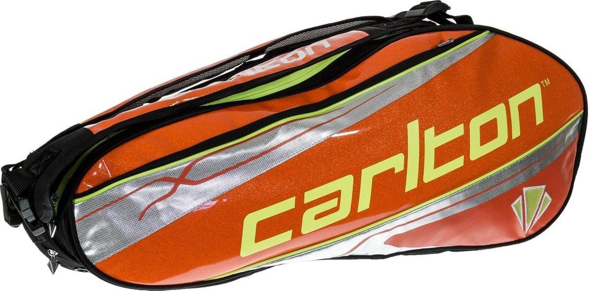 An orange and silver Carlton Kinesis Tour 2 Comp 6 Piece Racket Bag designed by Carlton to carry up to 6 rackets, featuring the brand name prominently printed in yellow. Its sleek design is further enhanced by reflective stripes and zippers, making it ideal for transporting sports equipment.