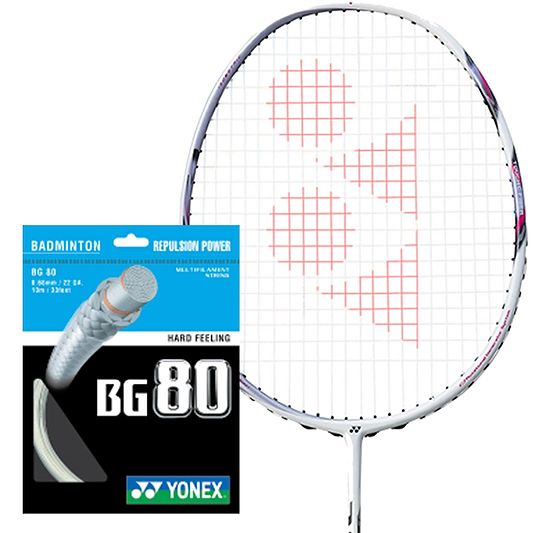 A Yonex badminton racket with a white frame and red strings is positioned beside a Yonex BG 80 Badminton String packet, featuring "Repulsion Power" and "Hard Feeling," attributed to its multifilament core and high-modulus Vectran fiber construction.